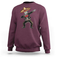 Maroon sweatshirt with dabbing skeleton mariachi graphic on front