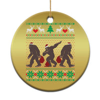Gold circle holiday ornament with Bigfoot squad silhouettes in festive sweater pattern