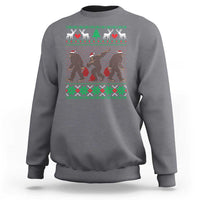 Light gray crewneck sweatshirt with holiday Bigfoot graphic and green red fair isle trim