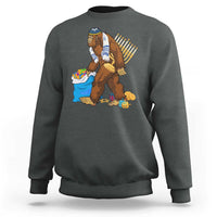Men's crewneck sweatshirt in charcoal with Hanukkah Bigfoot menorah graphic