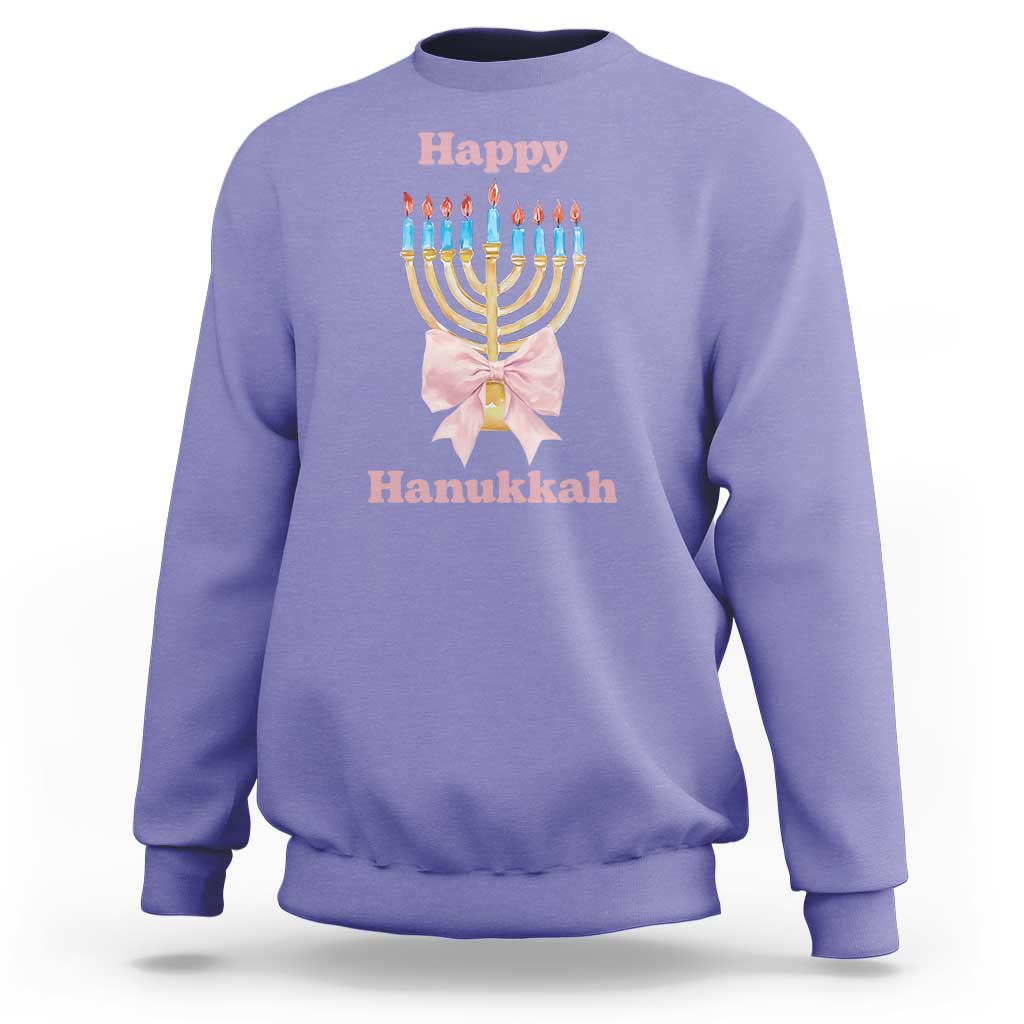 Purple crewneck sweatshirt with menorah graphic and pink bow at center chest