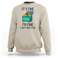 Sweatshirt with cat-and-dumpster graphic and “It's Fine, I'm Fine, Everything Is Fine” text, sand