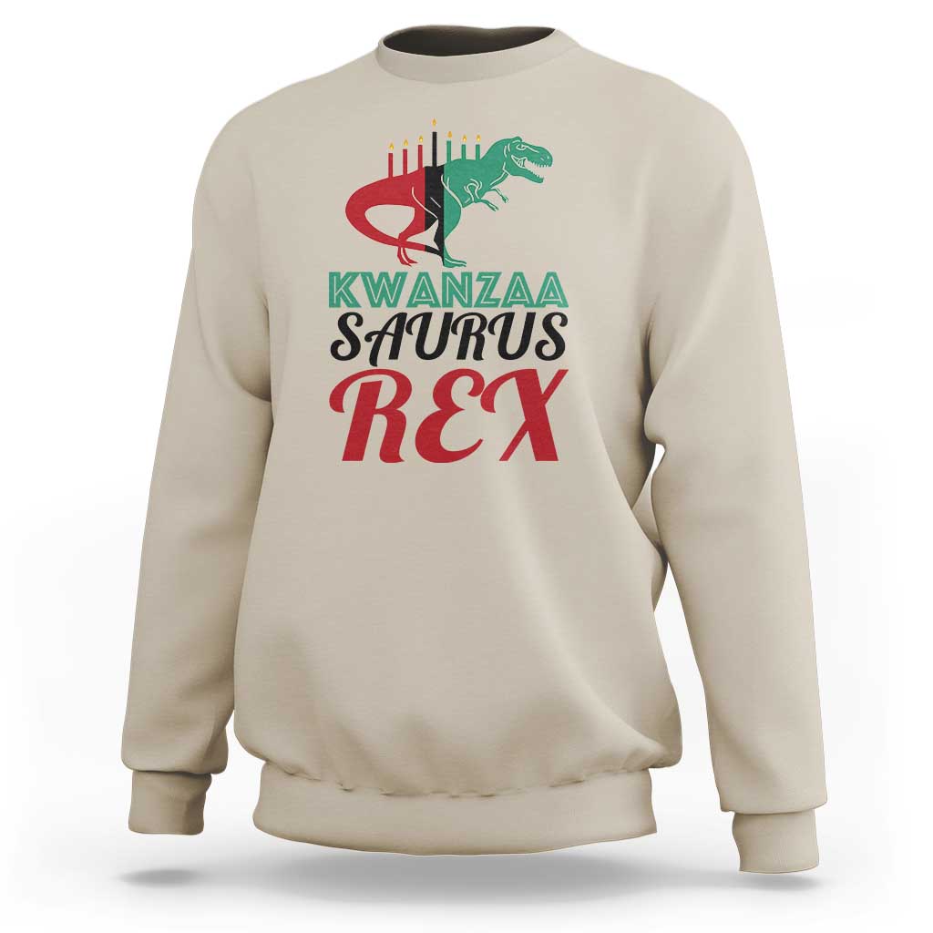 Kwanzaa Saurus Rex sweatshirt, sand, chest graphic with T-rex and Kwanzaa text.