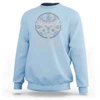 Light blue crewneck sweatshirt with faint silver antlered deer emblem graphic