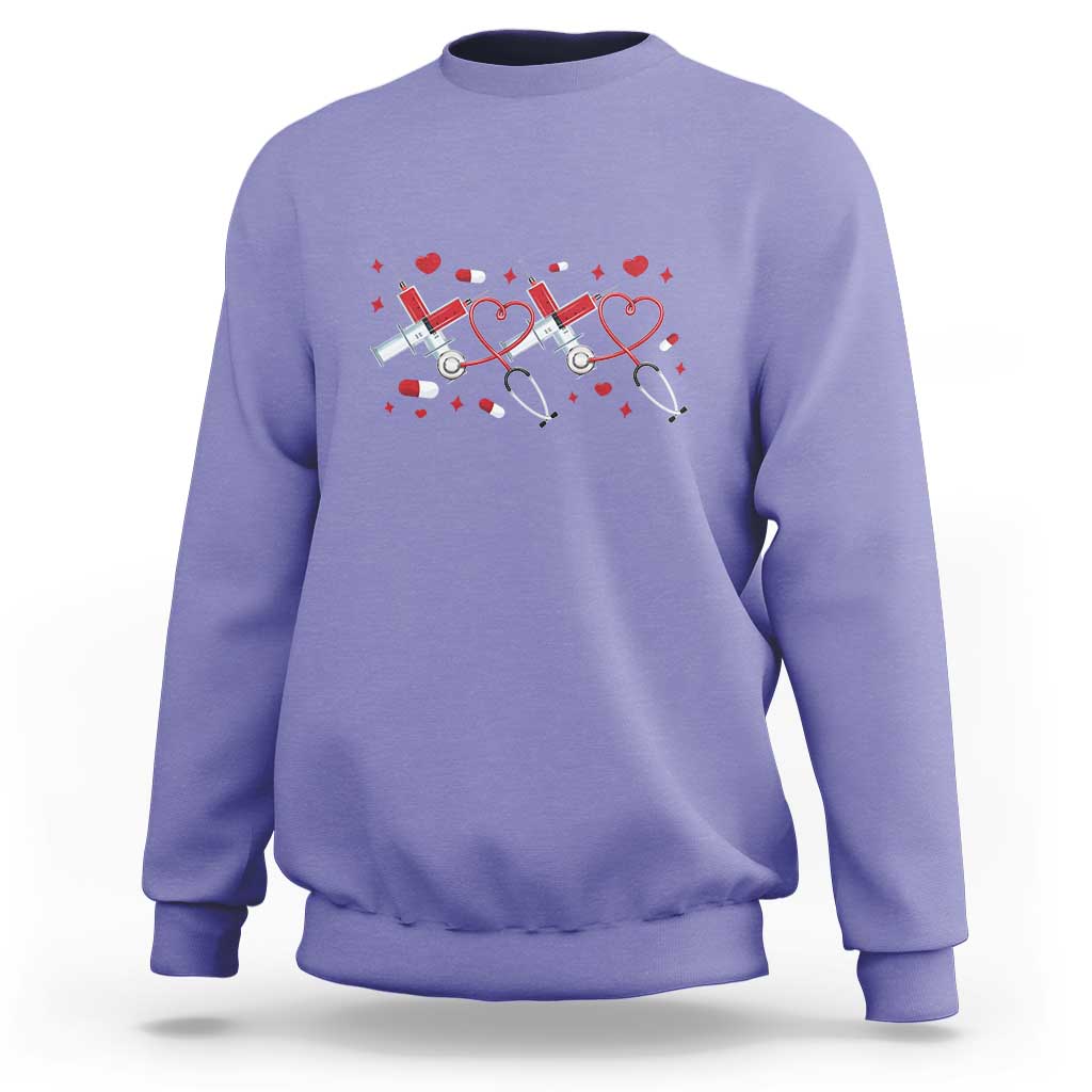 Purple crewneck sweatshirt with red heart stethoscope graphic on the front