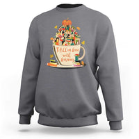 Dark heather gray teacher sweatshirt with pumpkin reading and books graphic, crew neck