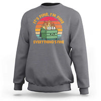 Charcoal gray crewneck sweatshirt with front graphic, flame dumpster, and “Everything’s Fine”