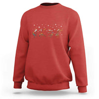 Red crewneck sweatshirt with Kokopeli, reindeer and snowflake holiday graphic