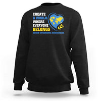 Black sweatshirt with "Create a world where everyone belongs" globe heart graphic
