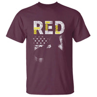Maroon crew-neck T-shirt with distressed patriotic flag and large “RE” graphic on front
