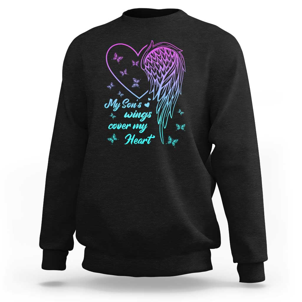 Black sweatshirt with colorful butterfly wing and heart graphic on the front
