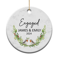 Personalized engaged circle Christmas ornament with “Engaged,” James & Emily, 2024.
