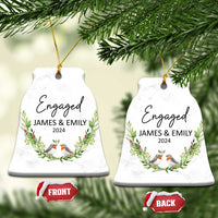 Set of two personalized engaged bell-shaped Christmas ornaments with “Engaged,” James & Emily, 2024.