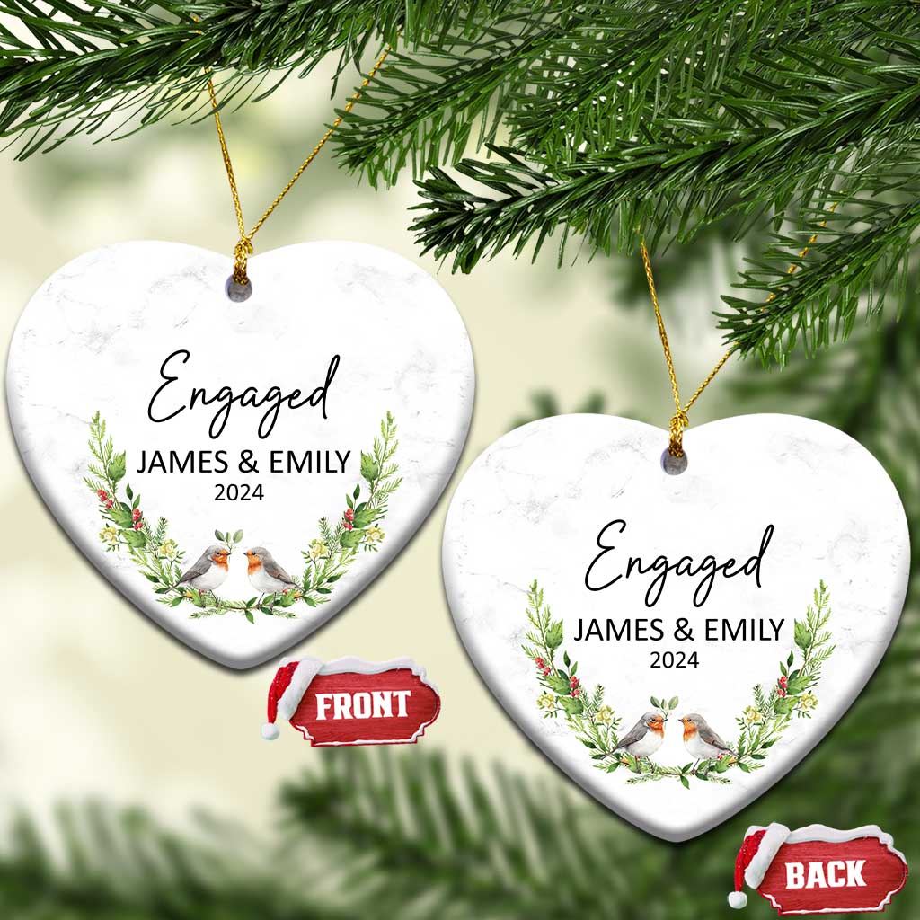 Personalized engaged heart-shaped Christmas ornament with “Engaged,” James & Emily, 2024, and birds.