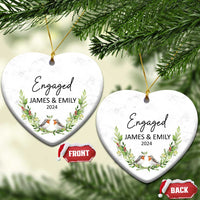 Personalized engaged heart-shaped Christmas ornament with “Engaged,” James & Emily, 2024, and birds.