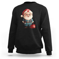 Black crewneck sweatshirt with smiling Santa doctor graphic and red cross badge