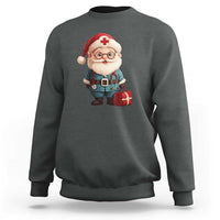 Dark heather gray crewneck sweatshirt featuring Santa doctor graphic with red medical cross