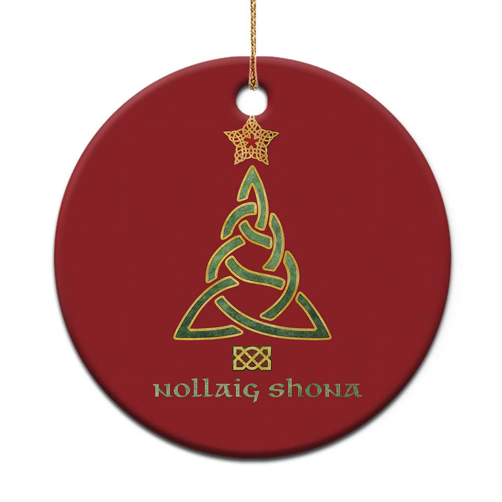 Red circular Christmas ornament with Celtic knot tree, star topper, and Nollaig Shona text.