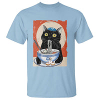 Light blue t-shirt with black cat face graphic over a blue noodle bowl
