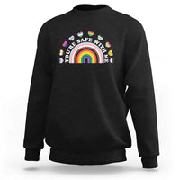 Black sweatshirt with rainbow heart pride graphic on the chest