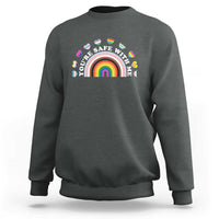 Dark heather gray sweatshirt with rainbow heart pride graphic on the chest