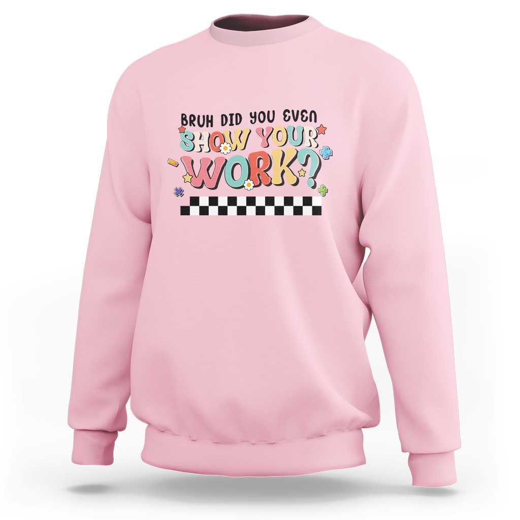 Light pink sweatshirt with colorful 'Show Your Work' text and checkered banner