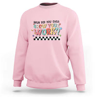 Light pink sweatshirt with colorful 'Show Your Work' text and checkered banner