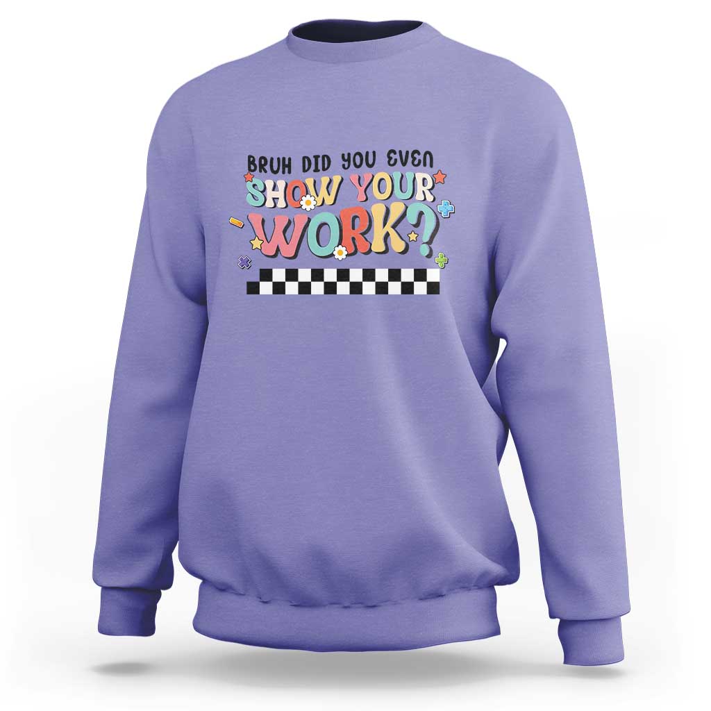 Purple sweatshirt with colorful 'Show Your Work' text and checkered banner