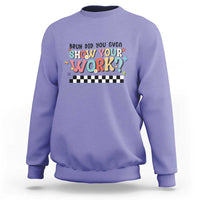 Purple sweatshirt with colorful 'Show Your Work' text and checkered banner