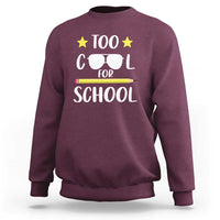 Maroon crewneck sweatshirt with 'Too Cool for School' sunglasses graphic