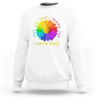 White sweatshirt with rainbow flower graphic and “Harris Walz” text on chest