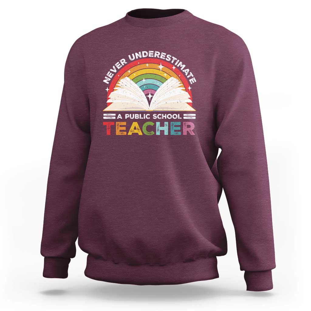 Maroon sweatshirt with rainbow teacher graphic on front and crew neckline