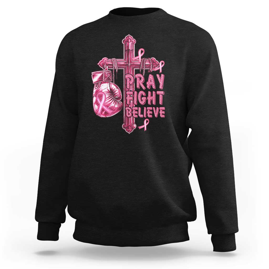 Black breast cancer awareness sweatshirt with pink cross graphic and Pray Fight Believe text