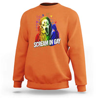 Orange crewneck sweatshirt with rainbow ghost graphic and 'SCREAM IN GAY' text