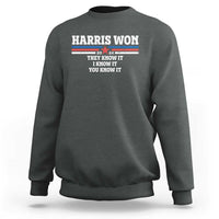 Dark heather gray crewneck sweatshirt with “Harris Won” graphic and “They know it” slogan.