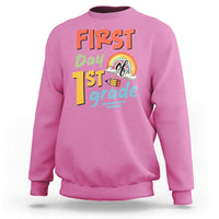 Pink kids sweatshirt with “First day 1st grade” front graphic and rainbow design