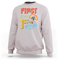 Light gray kids sweatshirt with “First day 1st grade” front graphic and rainbow design