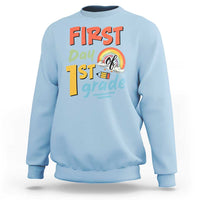 Light blue kids sweatshirt with “First day 1st grade” front graphic and rainbow design
