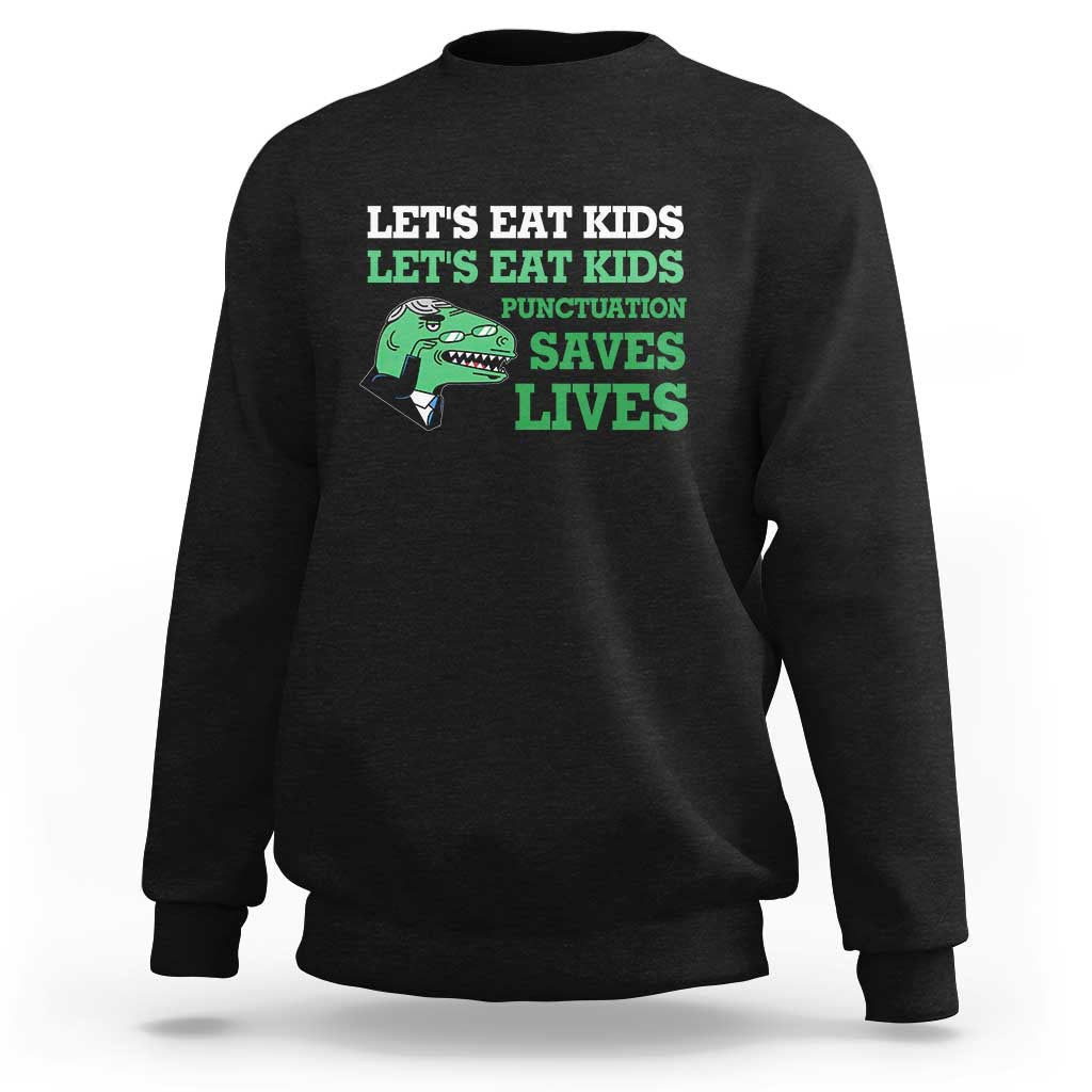 Kids sweatshirt, black, dinosaur graphic with 'Punctuation Saves Lives' slogan