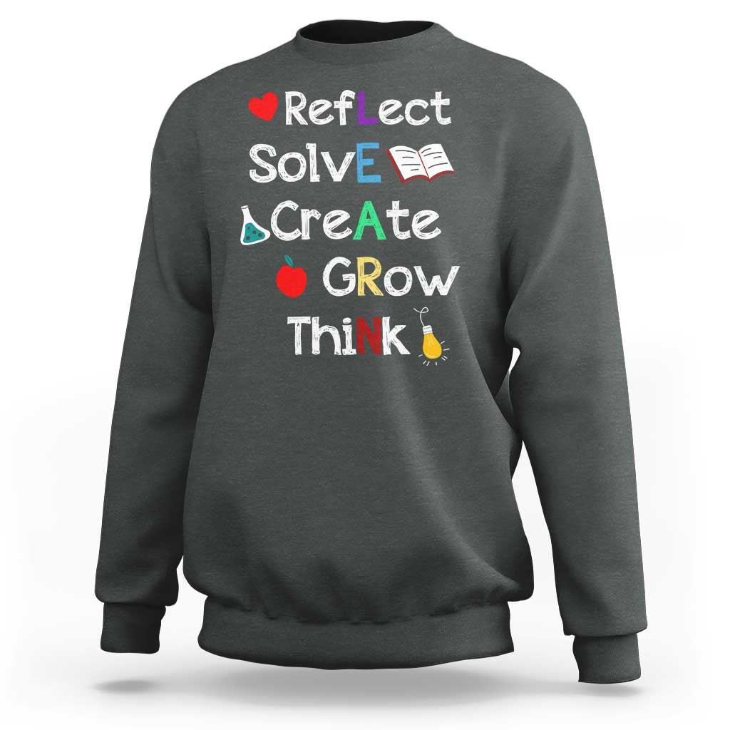 Back-to-school sweatshirt in dark heather with colorful motivational quote graphic on front