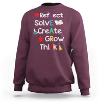 Back-to-school sweatshirt in maroon with colorful motivational quote graphic on front