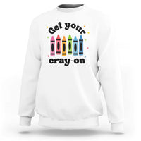 White sweatshirt with front “Get Your Cray-on” text and colorful crayon graphic