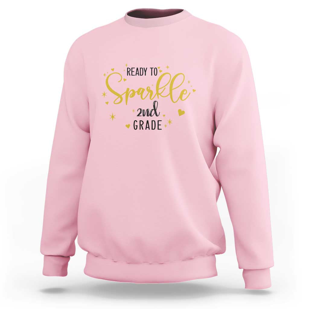 Light pink crewneck sweatshirt with “Ready to sparkle 2nd grade” sparkle graphic