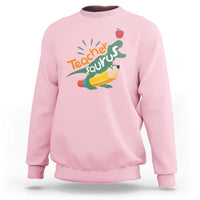 Light pink sweatshirt with Teacher Saurus dinosaur graphic and pencil, crew neck