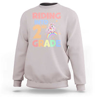 Very light gray unicorn sweatshirt with 'Riding into 2nd Grade' rainbow graphic