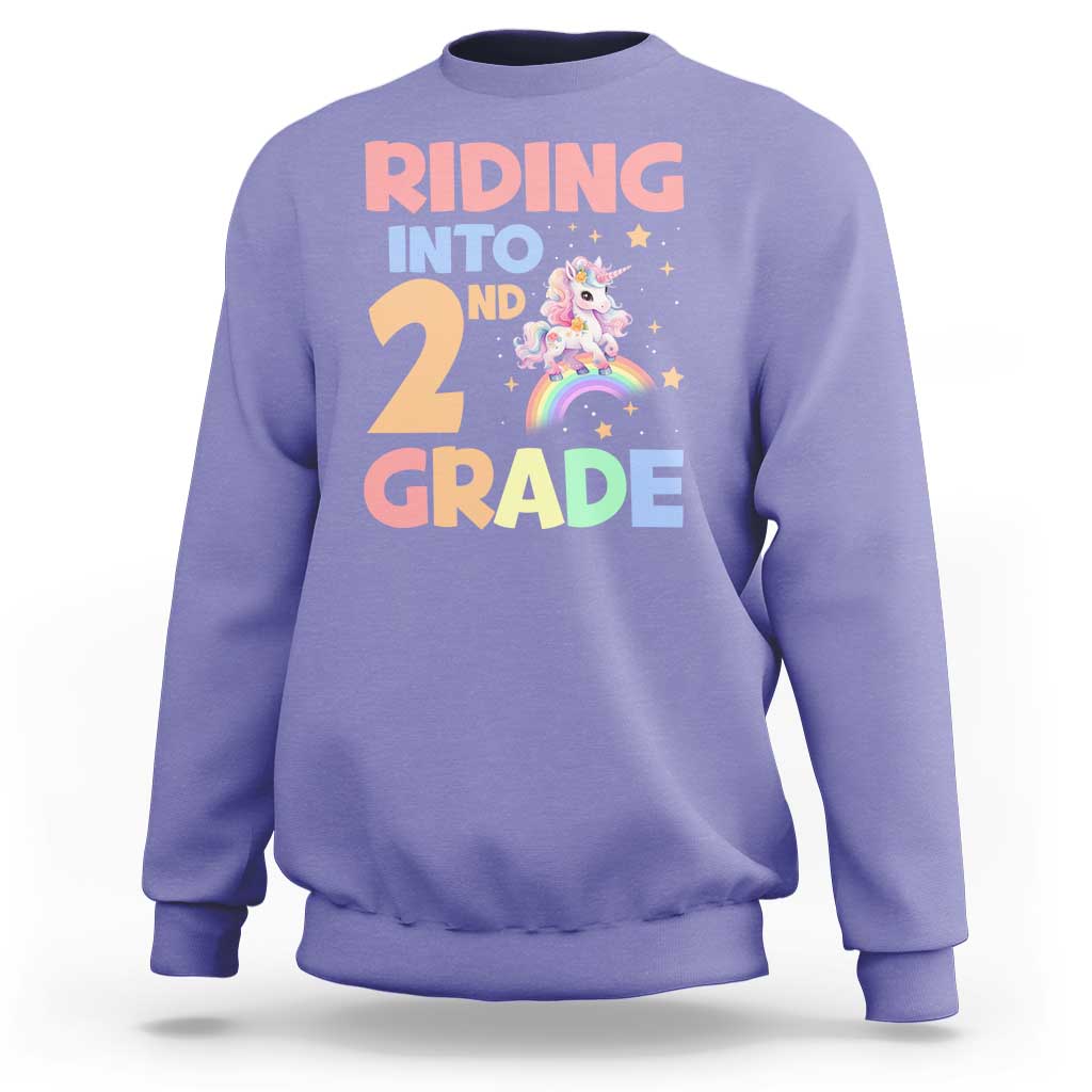 Lavender unicorn sweatshirt with 'Riding into 2nd Grade' rainbow graphic
