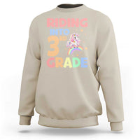 Beige sweatshirt with unicorn rainbow “Riding into 3rd Grade” front print