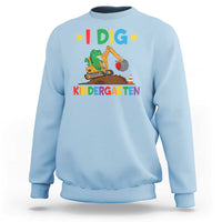 Kids light blue sweatshirt with “I DIG” dinosaur construction graphic and “KINDERGARTEN” text