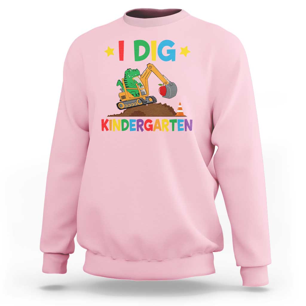 Kids light pink sweatshirt with “I DIG” dinosaur construction graphic and “KINDERGARTEN” text