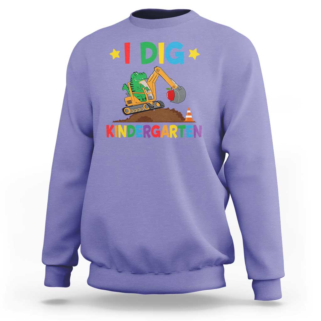 Kids purple sweatshirt with “I DIG” dinosaur construction graphic and “KINDERGARTEN” text